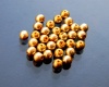 Stiklinis karoliukas apvalus aukso sp. (97487) 4 mm
